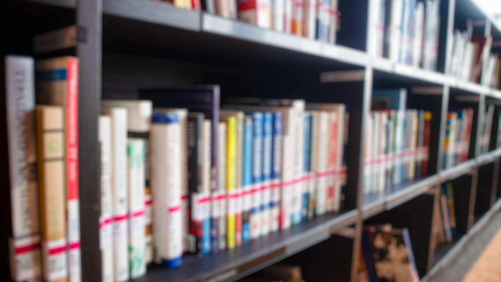 Library shelves filled with bound journals and books